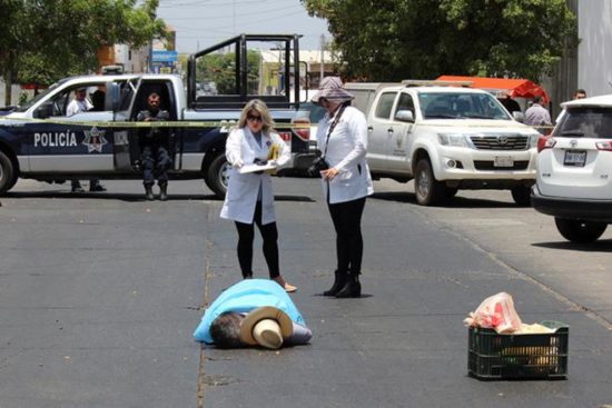 Javier Valdez' body was examined by authorities. (PHOTO: Reuters)