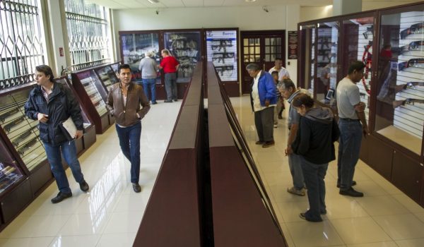 Customers look over guns for sale at Mexico's only legal gun shop. (PHOTO: ap.org)