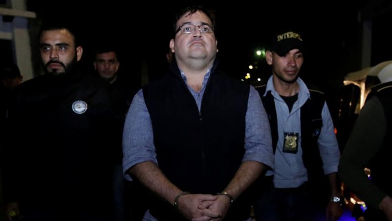 Duarte is escorted by authorities after he was detained in a hotel in Panajachel, Guatemala [Danilo Ramirez/Reuters]