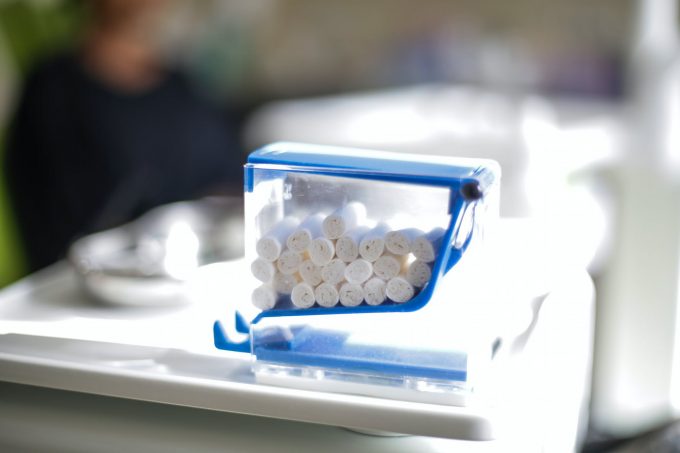 white cotton dental tampons in plastic container in clinic