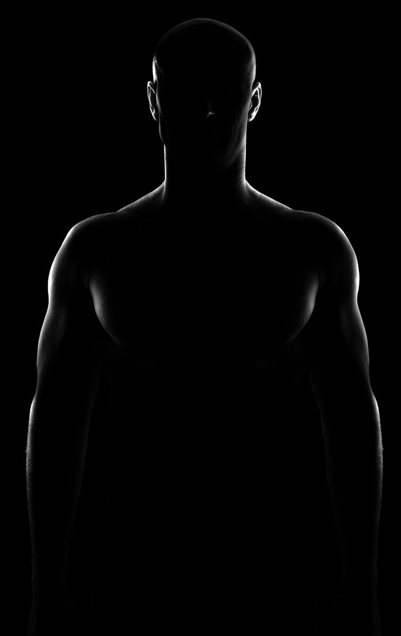 silhouette shot of a shirtless man