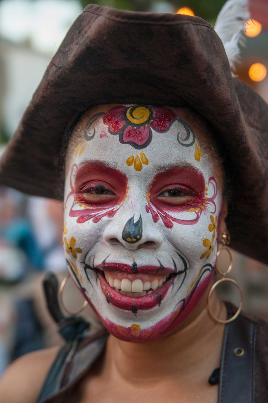 close up photo of a woman with face paint