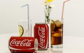 coca cola cans and glasses with lines