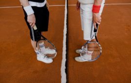 people holding tennis rackets