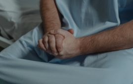 patient with his hands together
