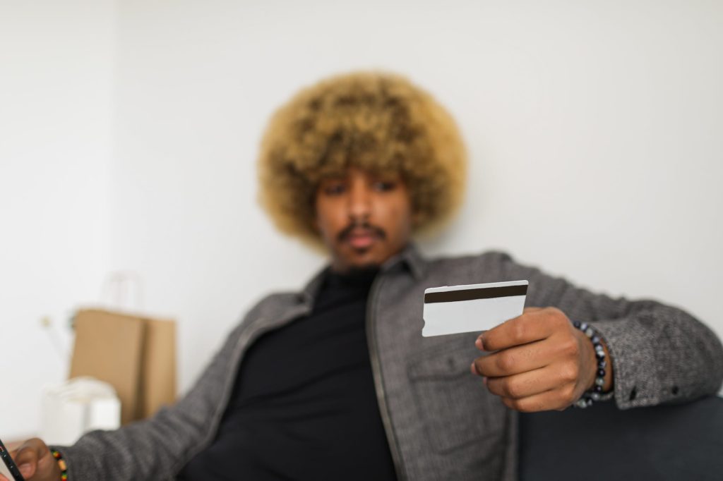 a man holding his credit card